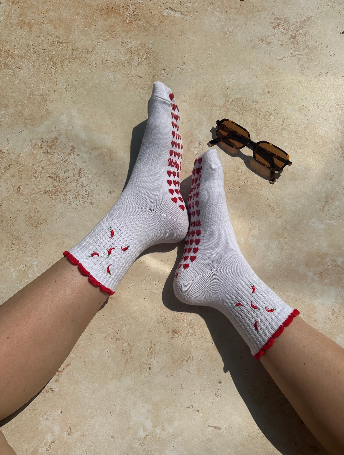 Red and white hot chili pepper grip sock with red heart grips