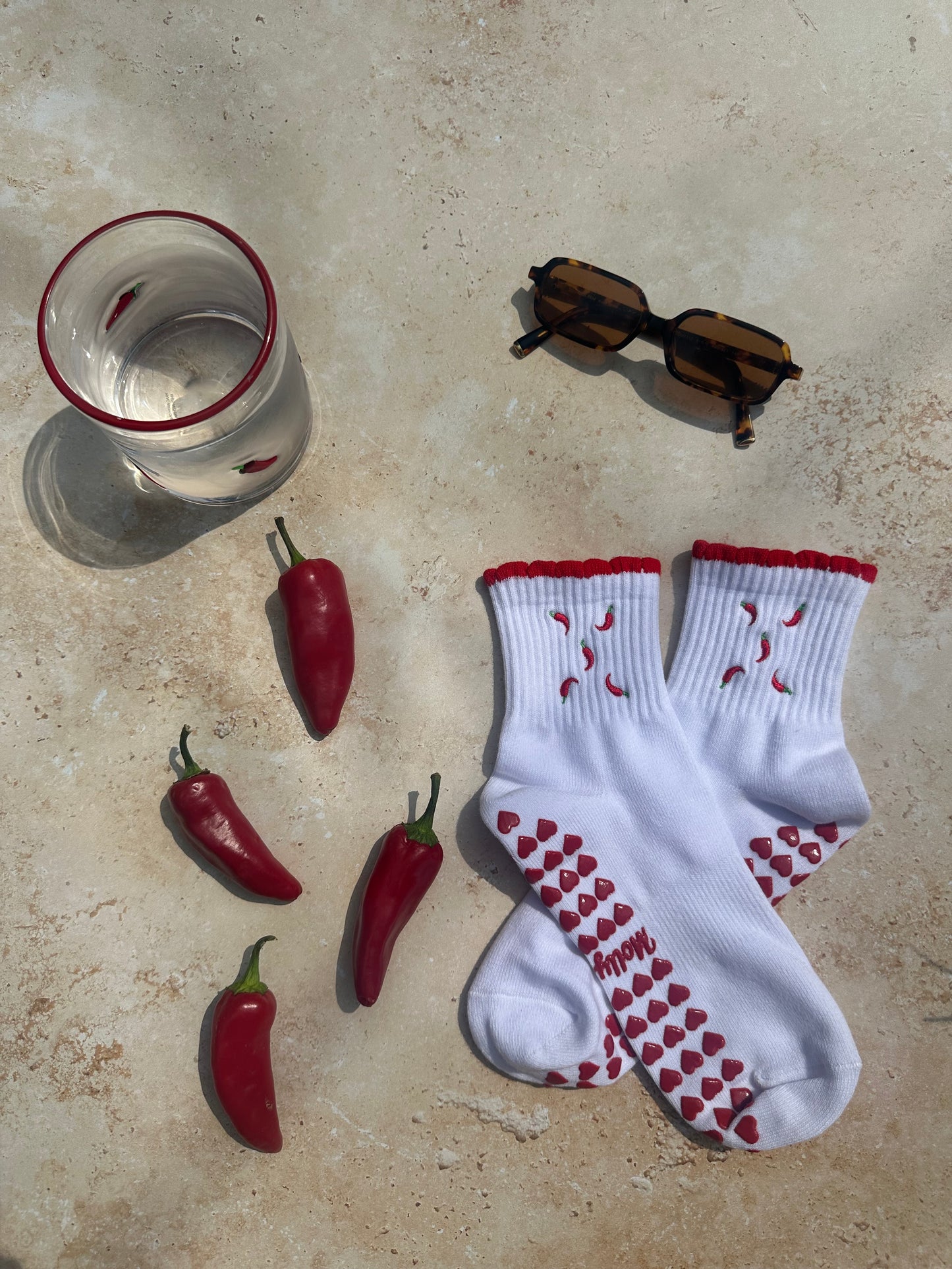 Red and white hot chili pepper grip sock with red heart grips
