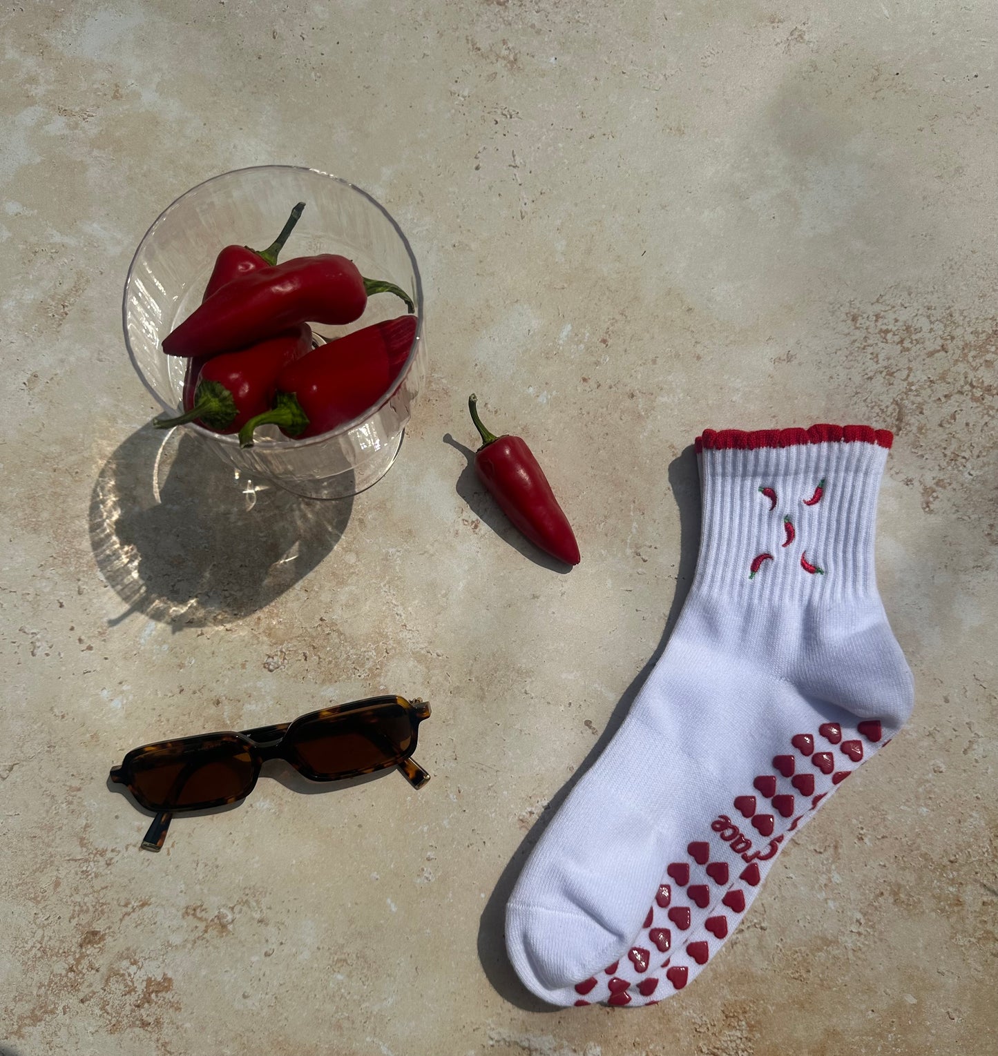 Red and white hot chili pepper grip sock with red heart grips