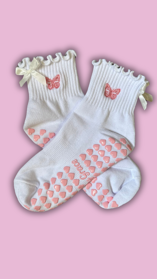 White ruffle grip sock with white bow and pink embroidered butterfly