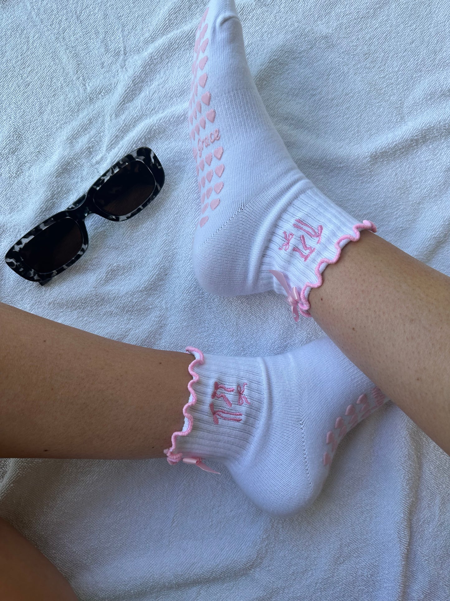 Pink bow coquette grip sock with pink heart grips