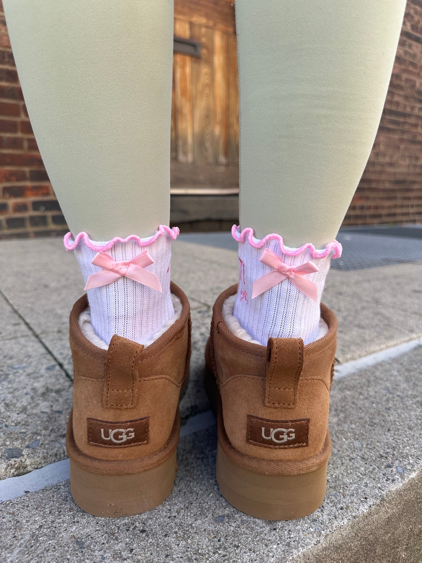 Pink bow coquette grip sock with pink heart grips