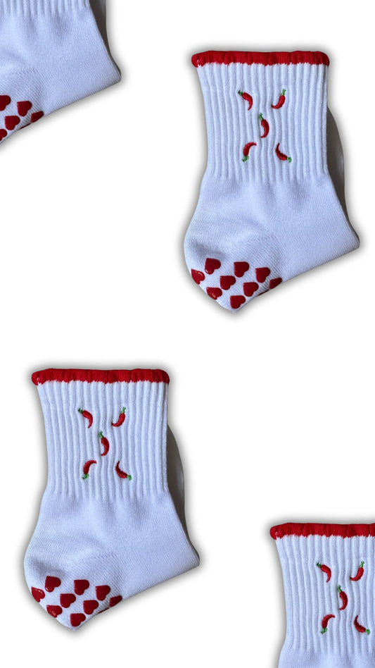 Red and white hot chili pepper grip sock with red heart grips