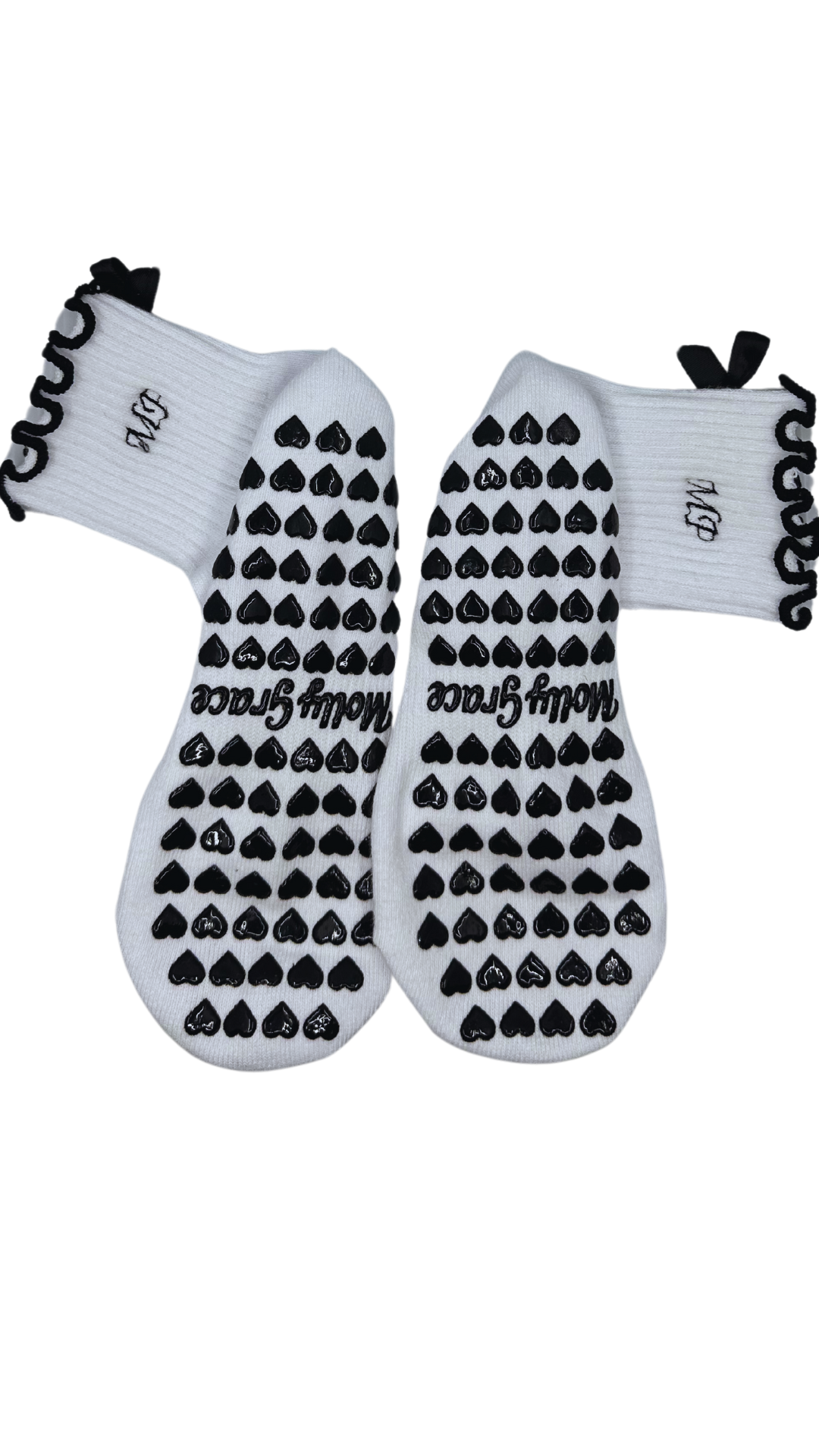 Black & white custom embroidered initial grip socks with black bow